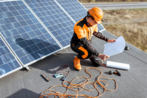 Electrician installing solar panels