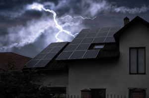 Lightning over house with solar panels